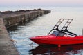 Red motor boat moored at the pier Royalty Free Stock Photo