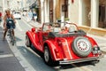 Red Motor car in the city street.