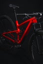 Red mountain bicycle on black background. Mountain bike.