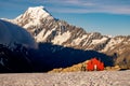Red mountain hut and Mt Cook in the background, New Zealand Royalty Free Stock Photo