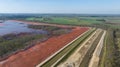 Red mud, bauxite residue, is an industrial waste generated during the processing of bauxite into alumina using the Bayer process Royalty Free Stock Photo