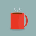 A red mug with a hot drink on it.