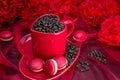 Red mug with macaroon rosted coffee beans sexy red background