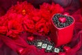 Red mug rosted coffee beans with heart chocolates red flowers Love letter