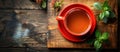 Red Mug of Tea on Wooden Table Royalty Free Stock Photo
