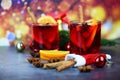 Red mulled wine glasses decorated table - Christmas mulled wine delicious holiday like parties with orange cinnamon star anise Royalty Free Stock Photo