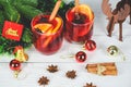 Red mulled wine glasses reindeer decorated table - Christmas mulled wine delicious holiday like parties with orange cinnamon star