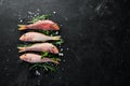 red mullet fish. Sea fish. Seafood on black background. Royalty Free Stock Photo