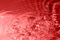 Red multi colored water drop bubbling Royalty Free Stock Photo