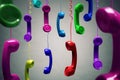 Red and multi-coloured telephone receiver hanging Royalty Free Stock Photo