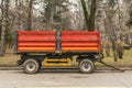 Red municipality trailer ready for park maintenance .