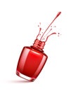 Red nail polish bottle with splash isolated Royalty Free Stock Photo