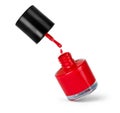 Red nail polish bottle with splash isolated on white Royalty Free Stock Photo