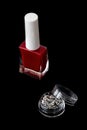 Red nail polish with little box of sparkles Royalty Free Stock Photo