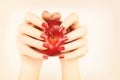 Red nails manicure hand with apple