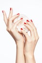 Red Nails. Woman Hands With Flower And Red Manicure Royalty Free Stock Photo