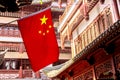 Red national flag of China against old chinese buildings at Yuyuan Garden in Shanghai, China Royalty Free Stock Photo