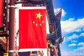 Red national flag of China against old chinese buildings at Yuyuan Garden in Shanghai, China Royalty Free Stock Photo