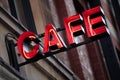 Red neon cafe sign, illuminated at night Royalty Free Stock Photo