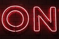 Red neon capital letters writing with black background Royalty Free Stock Photo