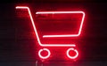 Red neon shopping cart on wooden surface