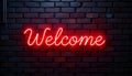 Vibrant Red Neon Welcome Sign on a Brick Wall Royalty Free Stock Photo