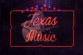 Red Neon Texas Music Sign in Rainy Window