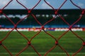 Red net robe of goal football or soccer at the stadium with dark forest tone. Royalty Free Stock Photo