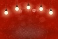 red pretty shiny glitter lights defocused bokeh abstract background with light bulbs and falling snow flakes fly, celebratory Royalty Free Stock Photo