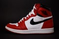 Red Nike Air Jordan I shoe with black background Royalty Free Stock Photo