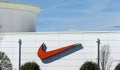 Red Nike swoosh logo on outside of store