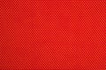 Red nonwoven fabric on a yellow Royalty Free Stock Photo