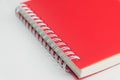 Red notebook isolated on white background.