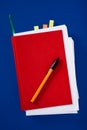 Red notebook with pen