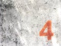 Red number four on dld dirt stains concrete wall texture background  and copy space Royalty Free Stock Photo