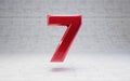 Red number 7. Metallic red color digit isolated on concrete background Royalty Free Stock Photo