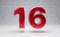 Red number 16. Metallic red color digit isolated on concrete background Royalty Free Stock Photo