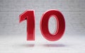 Red number 10. Metallic red color digit isolated on concrete background Royalty Free Stock Photo
