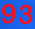 A red number plaque, showing the number ninety-three, 93