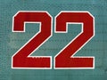Red 22 numbers on aircraft fuselage close up. Royalty Free Stock Photo