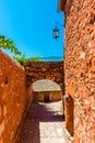 Red ochre mysterious street in the Roussillon village, Provence, France Royalty Free Stock Photo