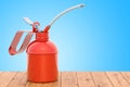 Red Oil Can on the wooden table. 3D rendering Royalty Free Stock Photo