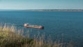 Oil tanker sails on the river