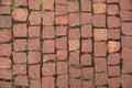 Red old brick paving stones background. Road surface made of brown rectangular stones. Close up of the detail of colorful cobblest Royalty Free Stock Photo