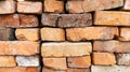 Red old brick wall background, brick wall texture. Stack of old weathered bricks used for construction or recycling Royalty Free Stock Photo
