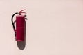Red old Fire extinguisher hung on concrete wall background. Royalty Free Stock Photo