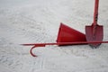 Red fireman scrap hook, spade, cone bucket shield against the background of sand Royalty Free Stock Photo