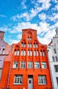 Red old gabled house facade with bay window in the old town of Wismar Royalty Free Stock Photo