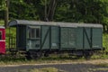 Red old historical diesel train with cargo green car in Ceska Kamenice town