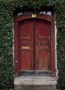 Red old rustic front door with ivy Royalty Free Stock Photo